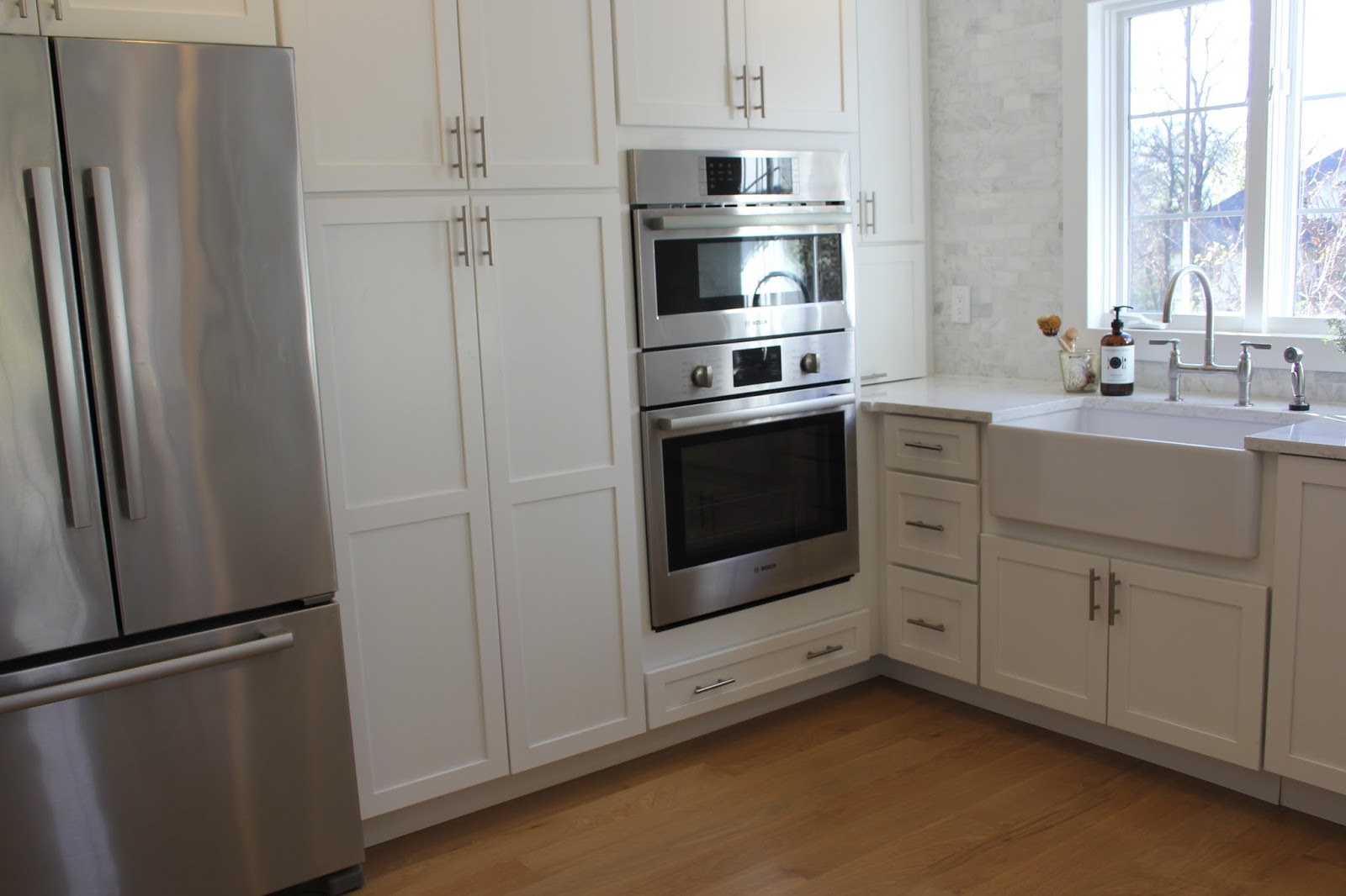 hello-lovely-studio-fixer-upper-white-kitchen-spare-farmhouse-table