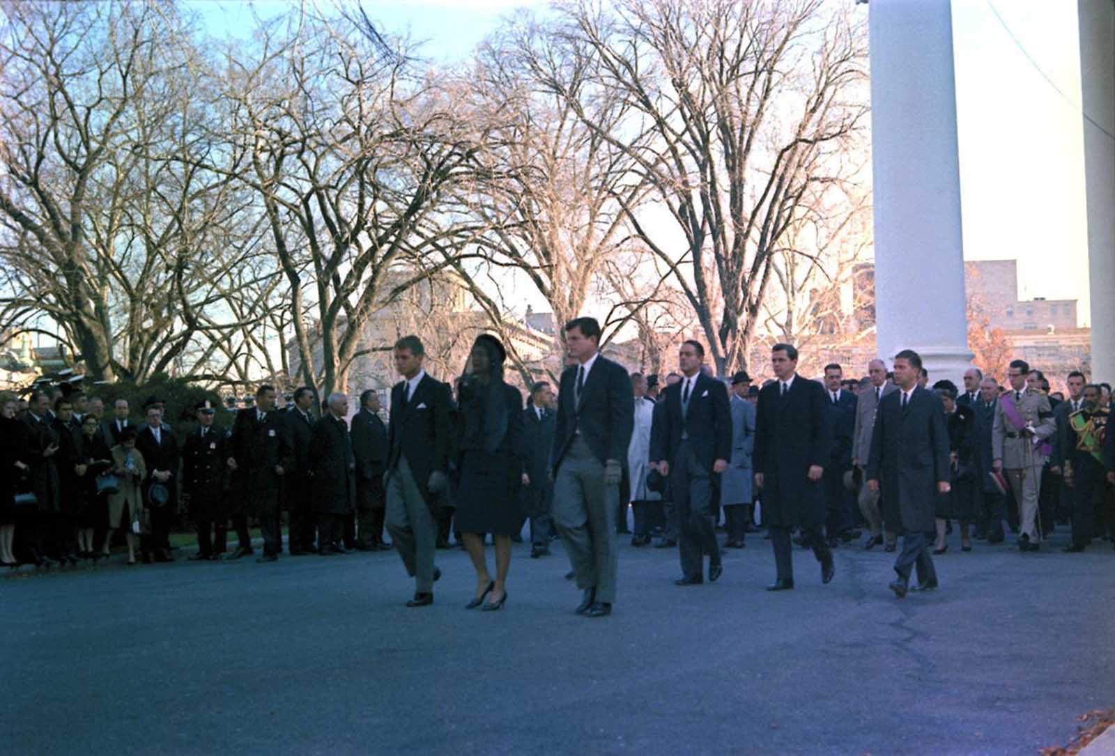 World leaders follow members of the Kennedy family in the funeral procession for the murdered president.