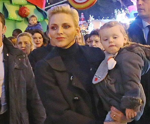 Princess Charlene, Princess Gabriella at opening the Monaco Christmas Village in Monaco. Style of Princess Charlene