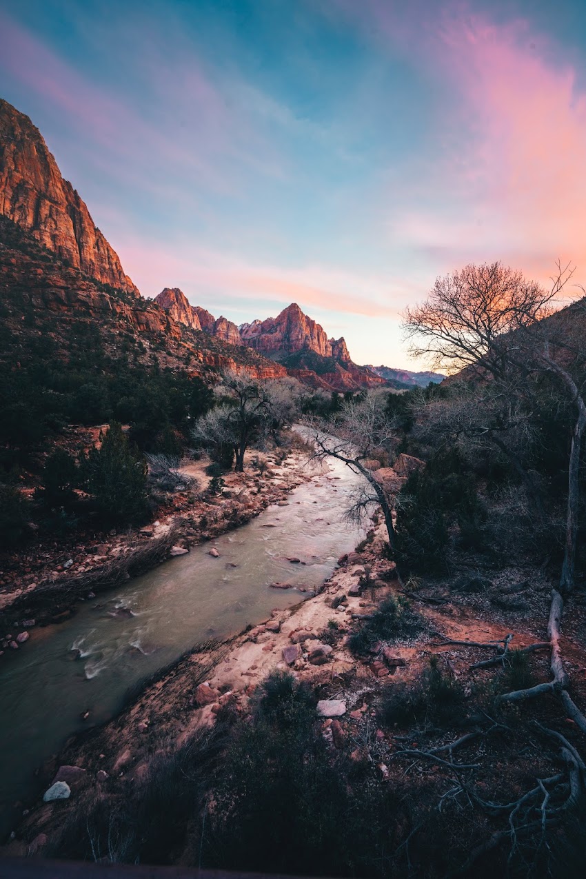Photo of River Near Trees And Mountains Photo of River Near Trees And Mountains