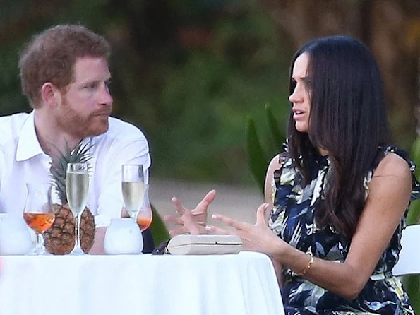 Prince Harry went to Jamaica in order to attend the wedding ceremony of the couple Tom Inskip and Lara Hughes-Young. Meghan Markle wore a flower printed silk maxi dress by Erdem Pre fall 2017 collection