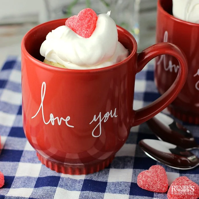 Vanilla Cake in a Mug (for Two) with whipped topping and a gummy heart in a red mug