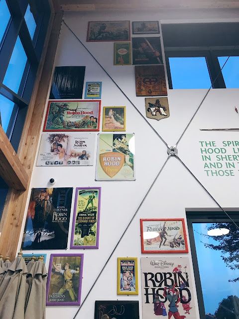 Cafe wall featuring movie posters of Robin Hood films