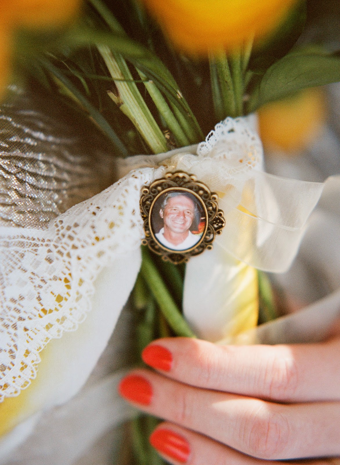 yellow and white spring bouquet tied with hand dyed silk ribbon and vintage lace with a memorial locket of the bride's father for a brooklyn, new york bride