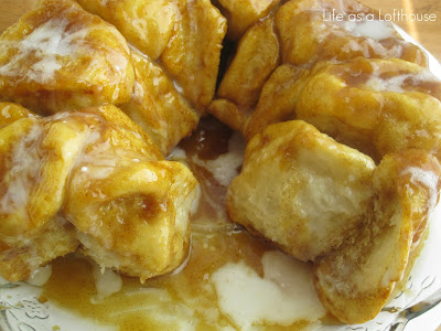Monkey bread is rolls covered in a butter, brown sugar and cinnamon mixture and a drizzle of a simple glaze. Life-in-the-Lofthouse.com