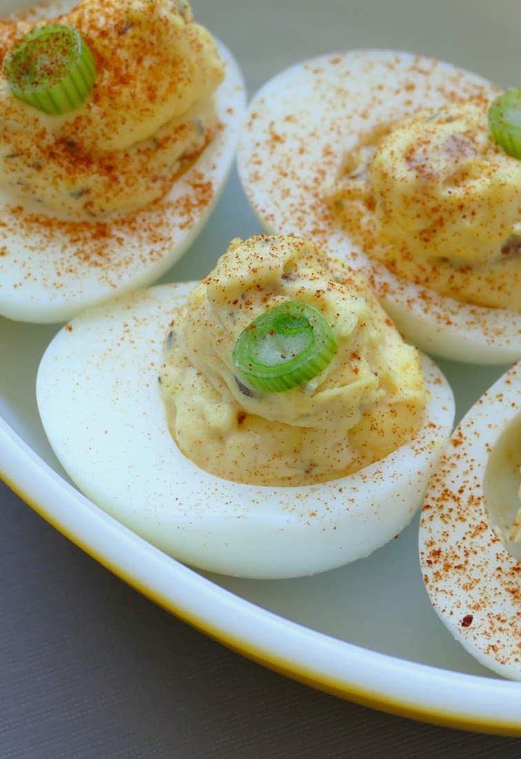 Easy Bacon Deviled Eggs Recipe! Look no further for your new favorite game day, party or holiday appetizer! This easy recipe is full of delicious bacon, basil, garlic and more!