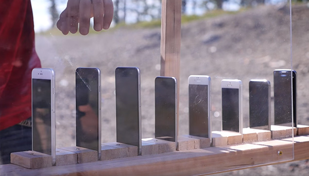 The man lines up the iPhones to test its durability.