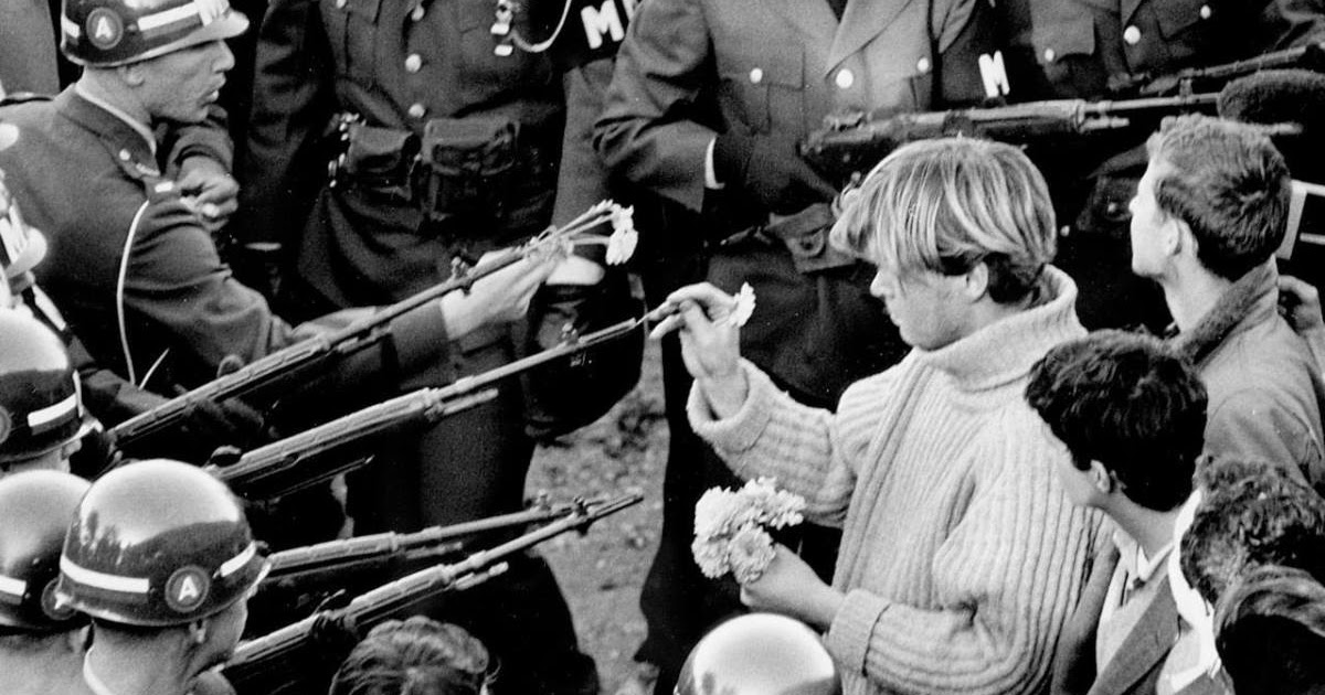 Be the Flower in the Gun The Story Behind the Historic Photograph