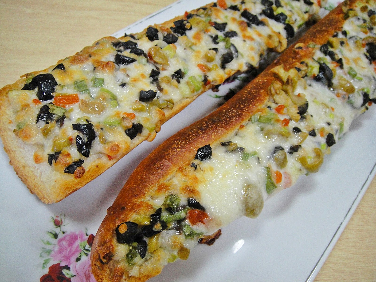 Maryam's Culinary Wonders 713. Cheesy Olive Baguettes
