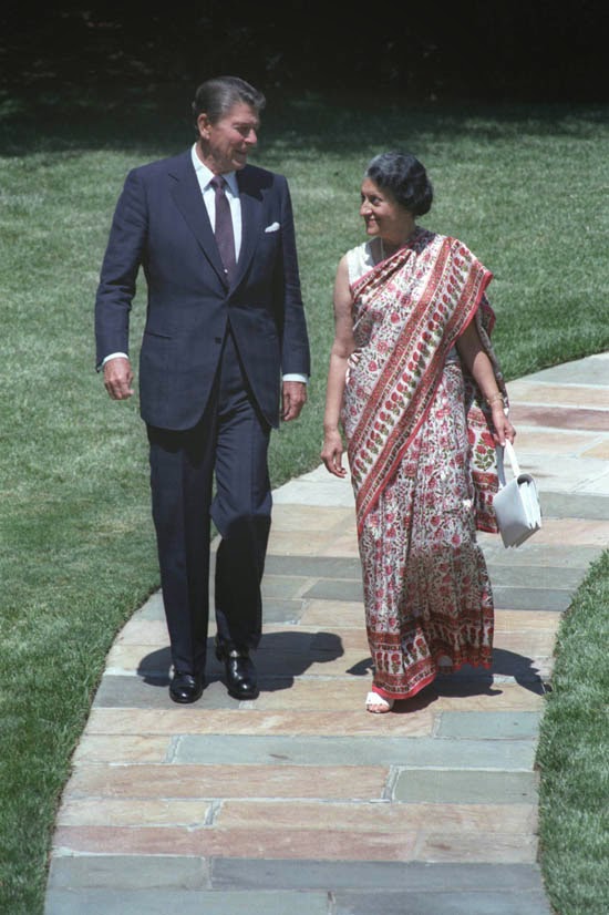 US President Ronald Reagan walking with Indian Prime Minister Indira Gandhi outside the Oval Office, White House - Washington DC July 1982