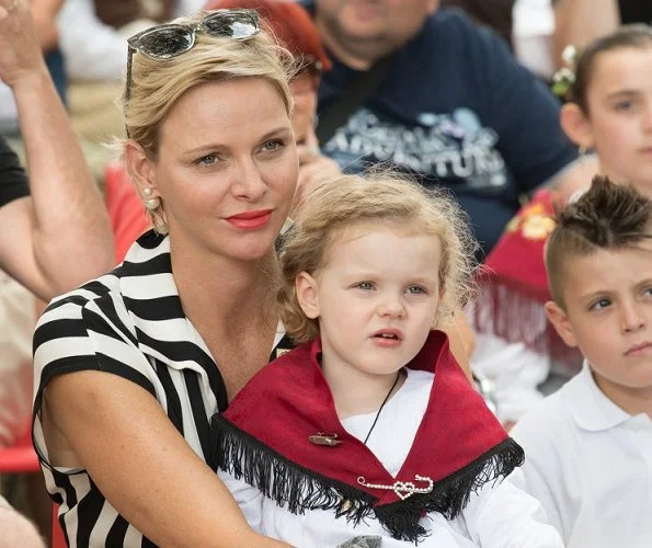 Princess Charlene wore AKRIS silk crepe striped dress and Stuart Weitzman Sandal. Princess Caroline, Beatrice Borromeo, Princess Gabriella