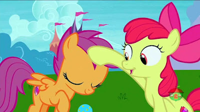 Apple Bloom pets Scootaloo for retrieving a ball