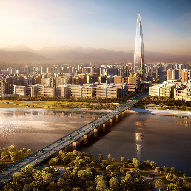 Photo of Lotte World Tower at sunset as seen from the air behind the river
