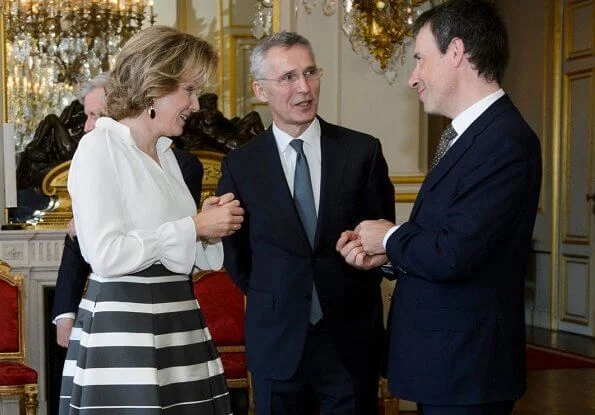 Queen Mathilde of Belgium held a new year's reception at the royal palace in Brussels. Queen Mathilde wore a skirt by Natan