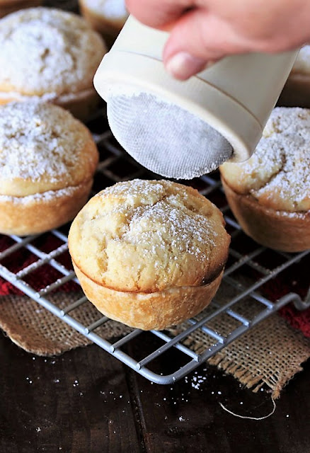 Dusting Baked Echo Cakes with Powdered Sugar Image