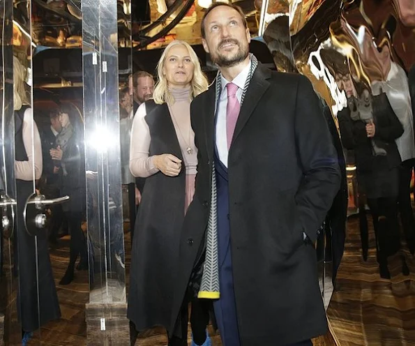 Crown Princess Mette Marit wore Valentino Cape, Prada wool sweater, Prada Boots, diamond earrings