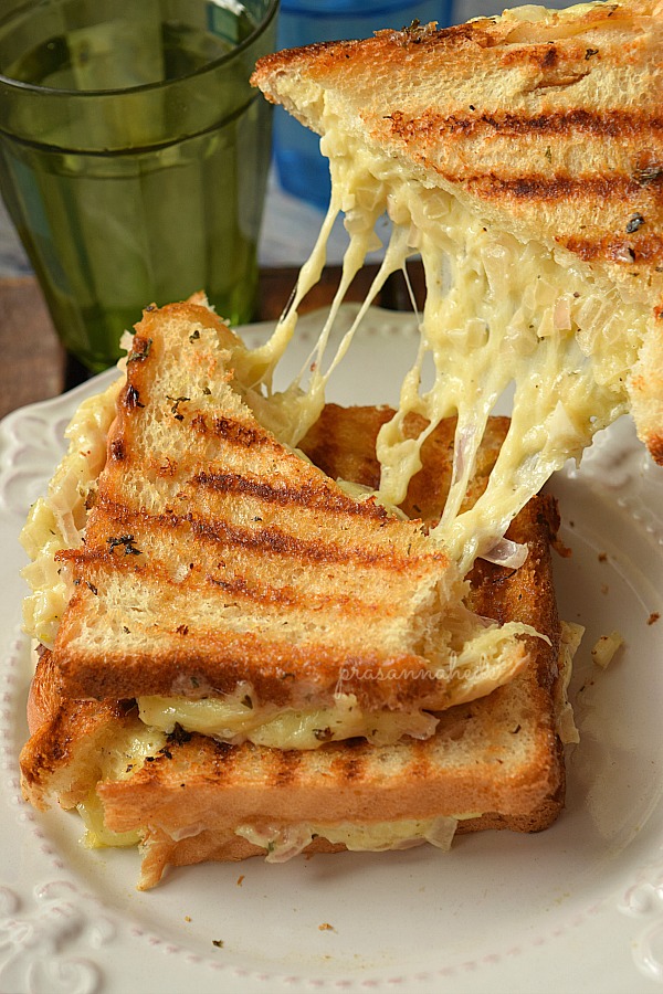 Delicious grilled cheese sandwich oozing cheese
