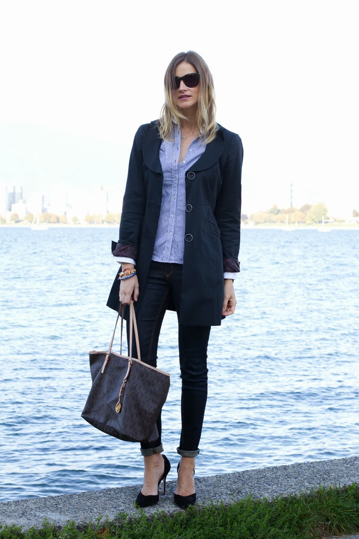 Vancouver Fashion Blogger, Alison Hutchinson, is wearing an RW & Co navy trench coat, Zara blue striped button up top, Rag & Bone skinny jeans, Zara black suede pumps, and a Michael Kors tote.