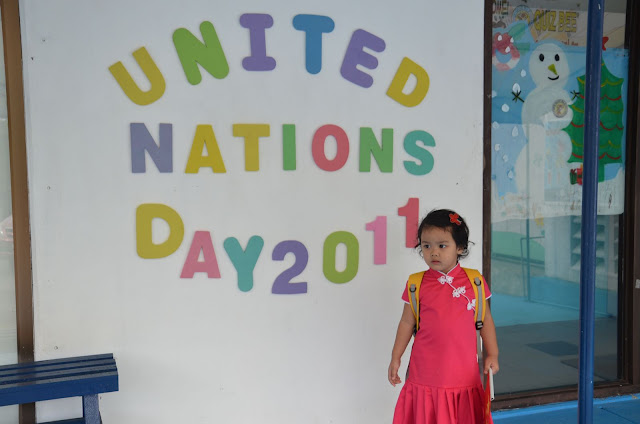 Kecil in front of the UN Day sign