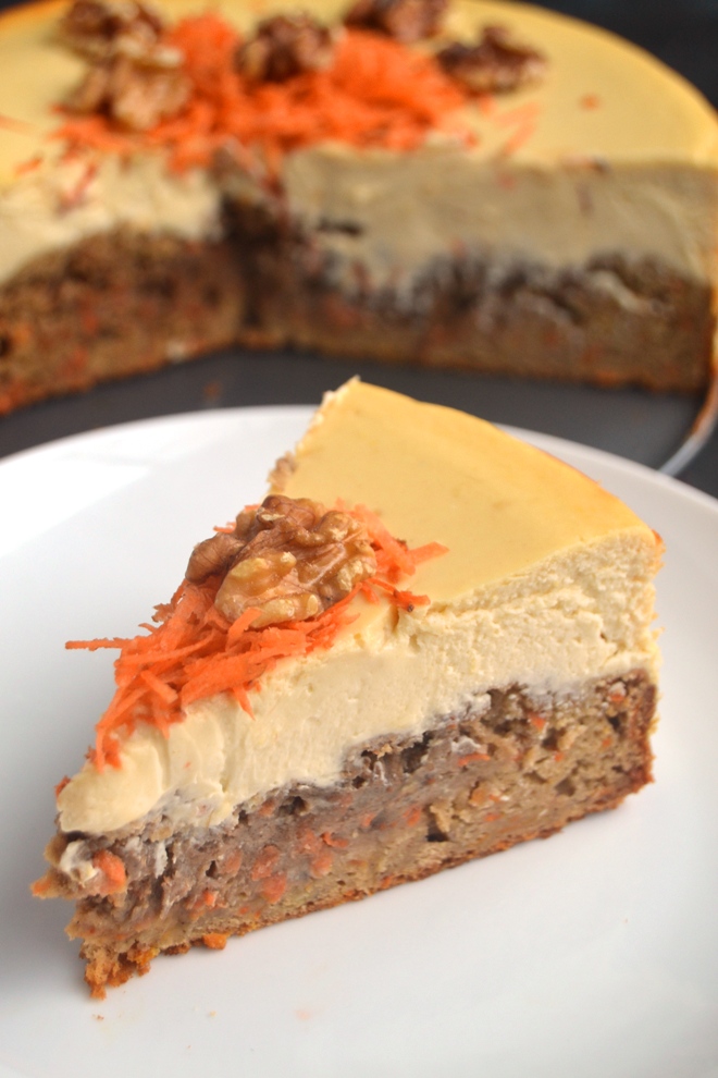 Carrot Cake Cheesecake features a whole-grain, dense carrot cake bottom and rich, creamy, Greek yogurt cheesecake combined in one for the perfect dessert! www.nutritionistreviews.com