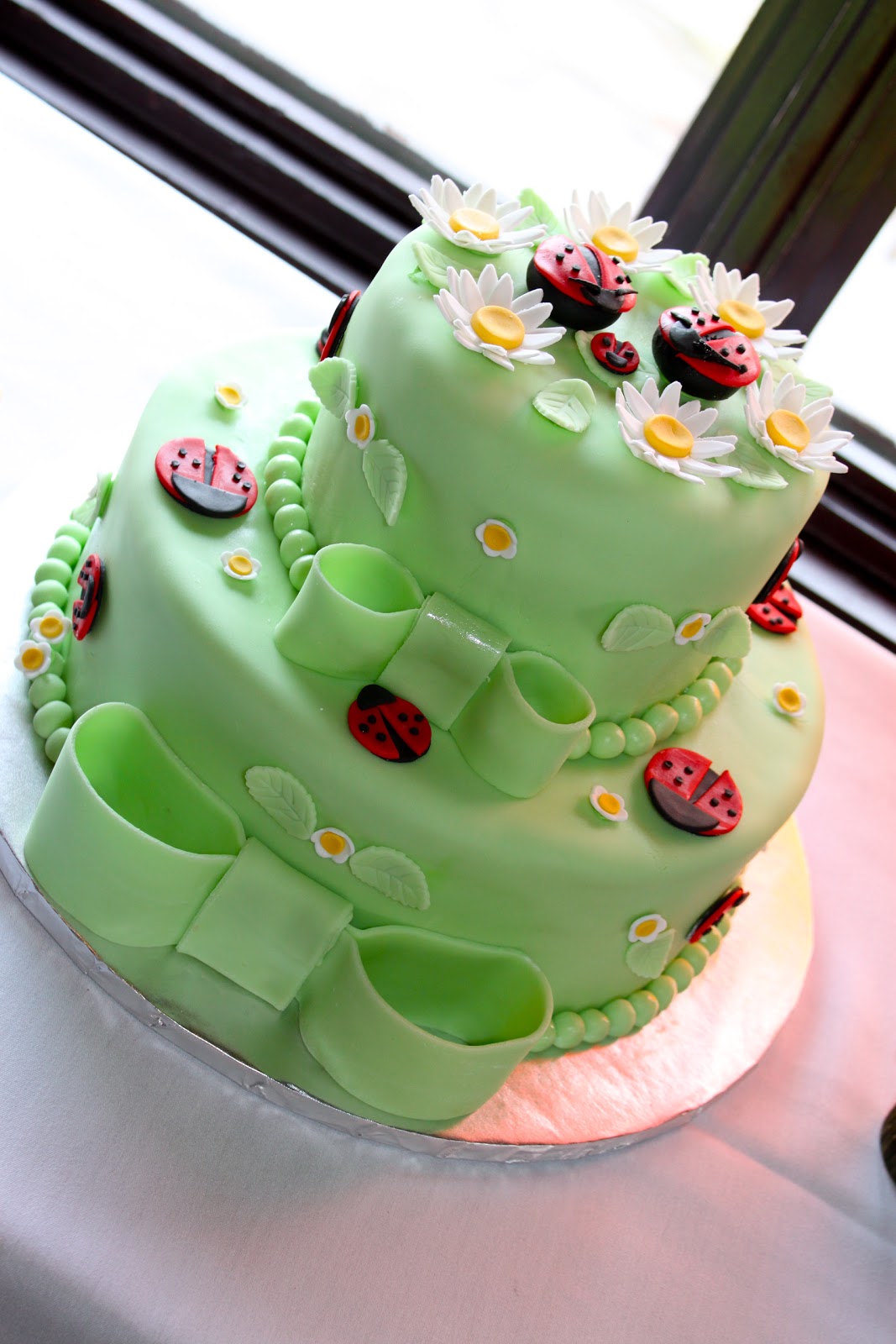 Cafe Coco Lady Bug Fondant Cake with White Vanilla Cake and Chocolate Cake and Raspberry Swiss