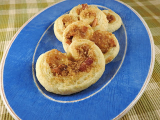 Brown sugar bacon pastries on blue plate