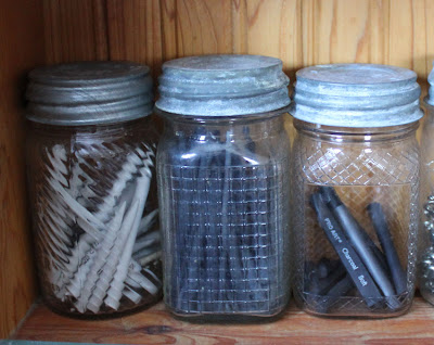 artist charcoal in glass jars