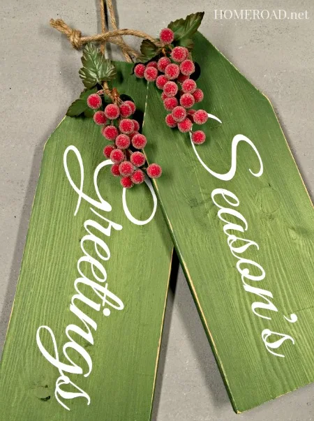 Green wooden Season's Greeting tags with red berries