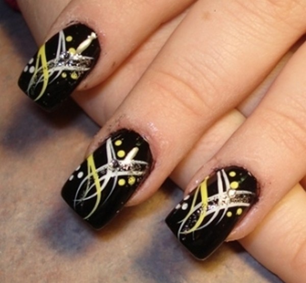 Black Nail Art with a White and Yellow Flowery Pattern