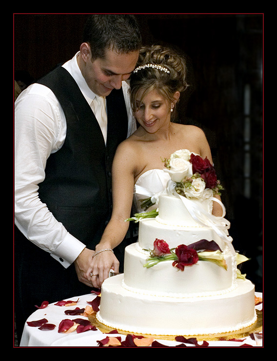 A Bride and Groom Cutting The Wedding Cake | Wedding Ido