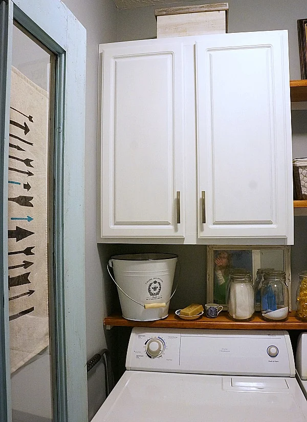 farmhouse laundry room with antique door