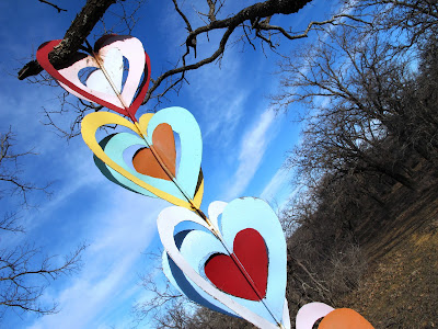 metal hearts hanging in a tree