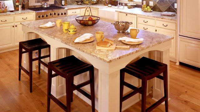 Hardwood floor is a beautiful choice for this kitchen.