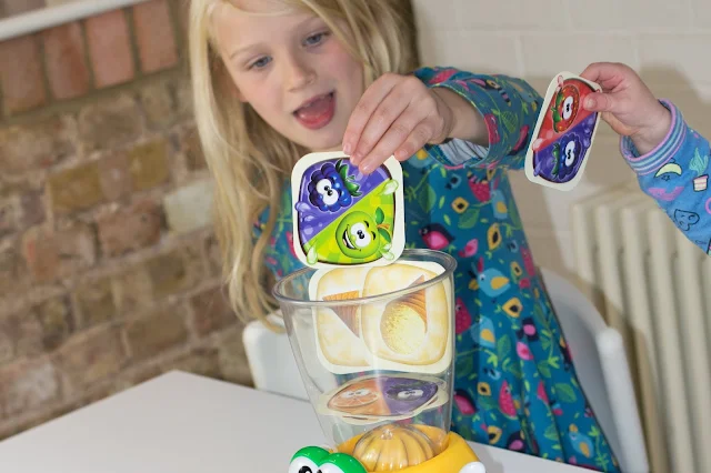 A child putting a apple and blackberry card into the Little Tikes Crazy Blender