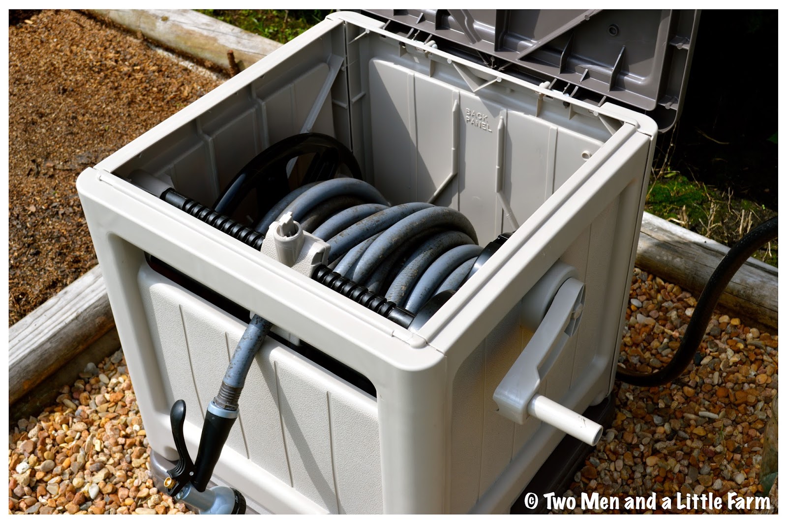 Two Men and a Little Farm HOSE REEL HIDEAWAY FLOWERBED
