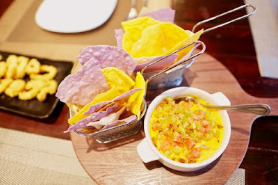 sisig nachos - Nachos served with a cheesy Sisig Dip