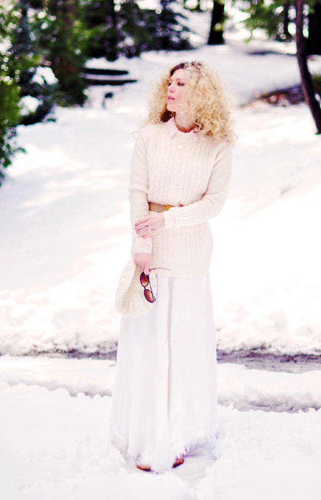 big blonde afro curls, light neutrals in the snow, winter style