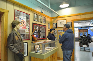 CAF Museum-WASPs Man looking at a museum display about Women Air Service Pilots