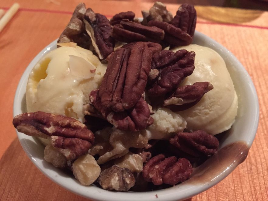 Ice cream topped with walnuts at Circles Event Cafe