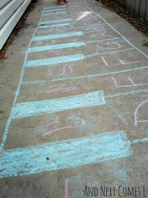 Close up of numbers and letters on a giant chalk piano keyboard drawing