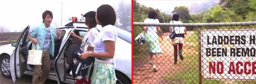 Tsutsumi and the girls get out of the taxi. / The girls run behind a fence with a "No Access" sign posted.