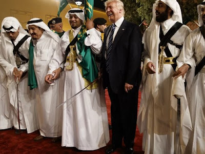 D. Trump with traditional Saudi sword dancers