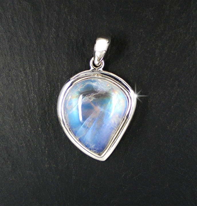 A moonstone, birthstone for June, more valuable if it is high in adularescence
