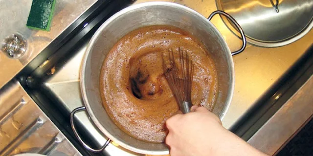stirring wort with a whisk 