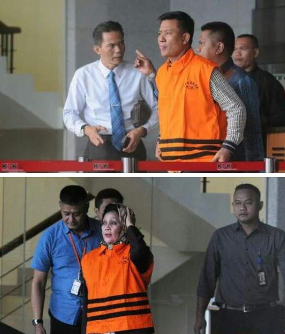 Muslim Simbolon dan Helmiaty saat memakai baju tahanan KPK. Muslim Simbolon dan Helmiaty saat memakai baju tahanan KPK.