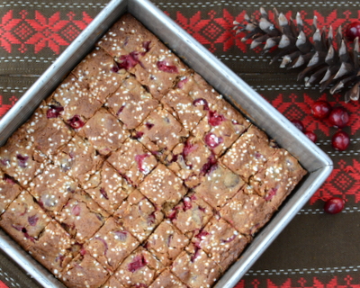 Fresh Cranberry Bars ♥ KitchenParade.com, chewy molasses-spice bars with bursts of sour cranberry and topped with a scattering of sugar 'snow'. Addictive!