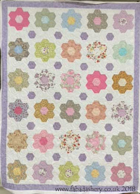 Grandmother's Flower Garden quilt made by Christine,  quilted by Frances Meredith