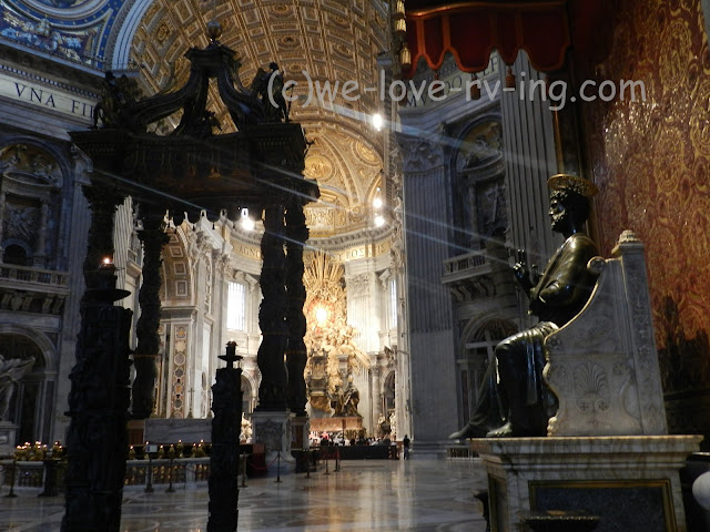 The small service is held at the front of this huge beautiful church