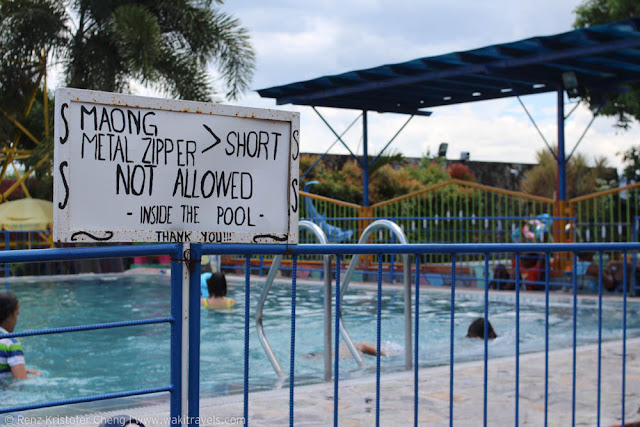 Sign near the pool of Casa Elum Resort, Bualcan