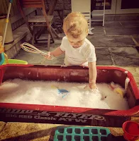 water and washing up liquid play outside